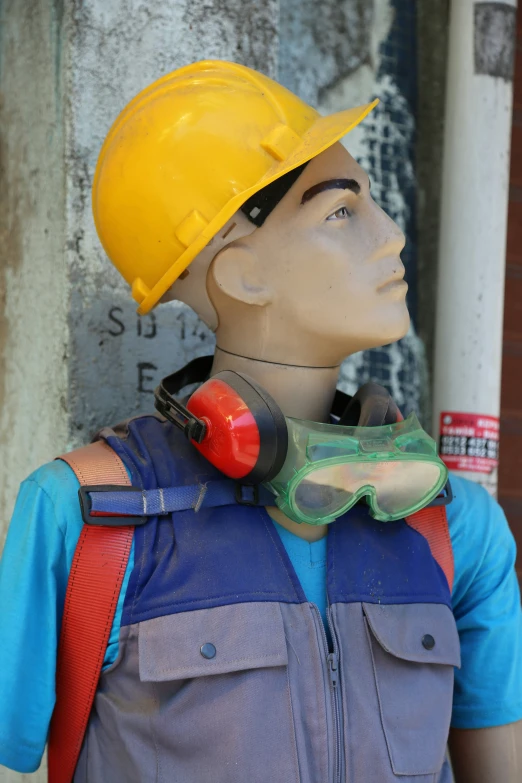 an industrial dummy wearing safety equipment