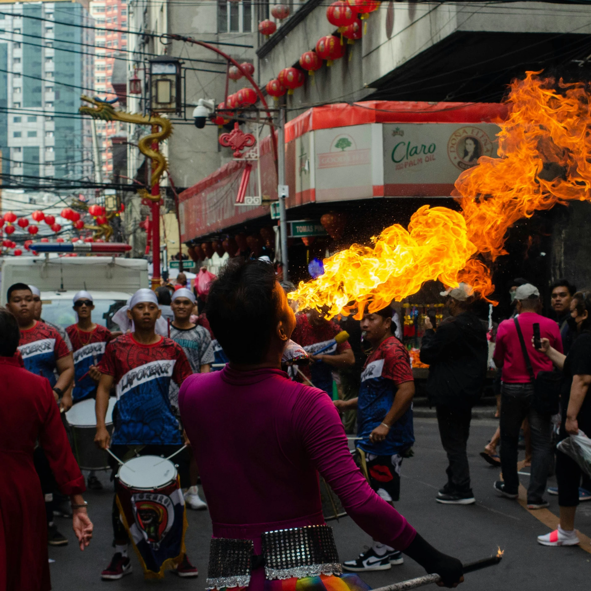 a person holding a stick in the street