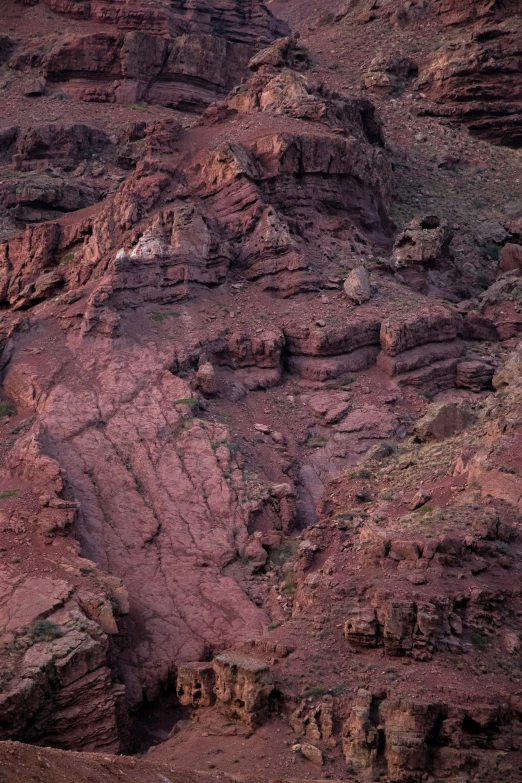 a red mountain with lots of red rock formations