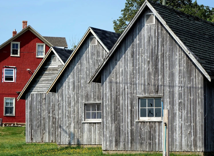 a house sits next to another building