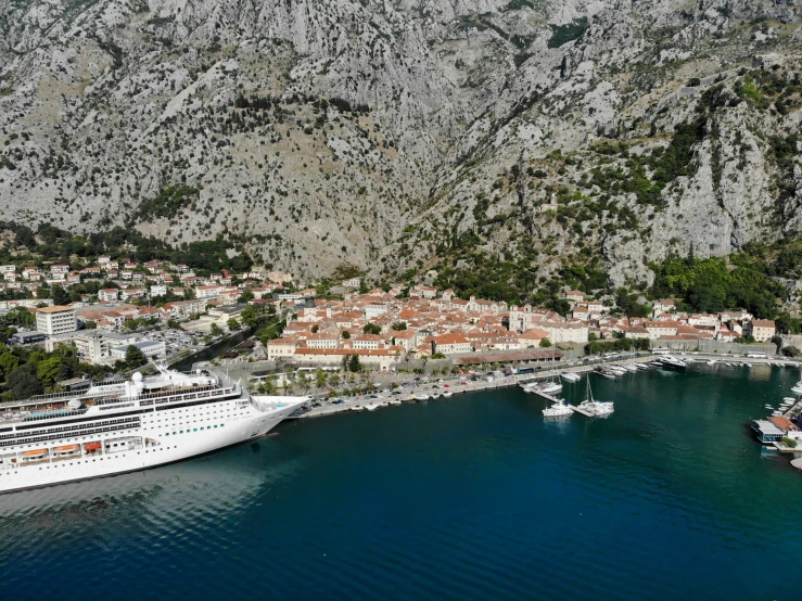 an aerial po shows the sea, city and mountain