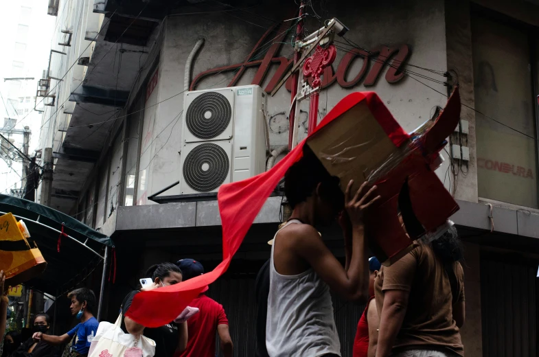 a person holding soing up above his head