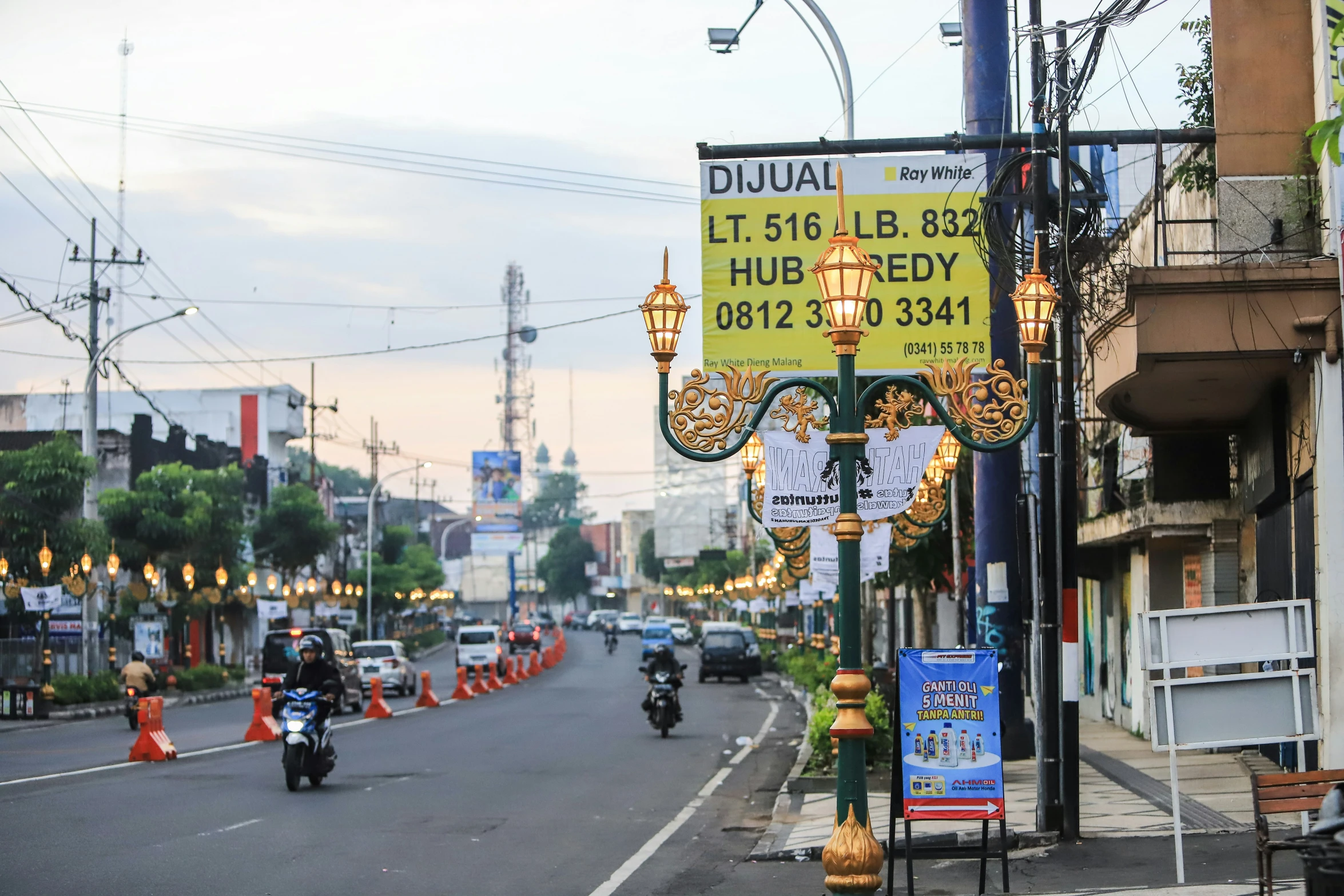 a group of people riding on motorcycles down a street