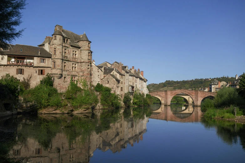 view of a bridge over a river with a river running under it