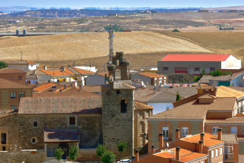 an aerial view of old town with brown tiles and red brick