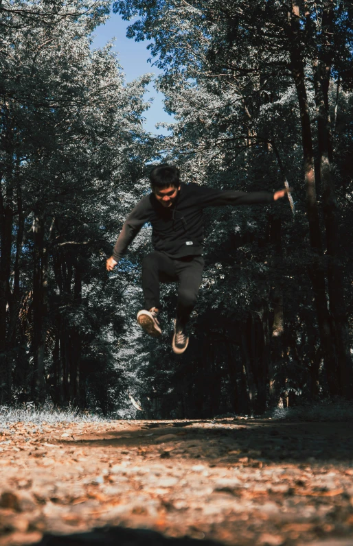 a man flying through the air while riding a skateboard