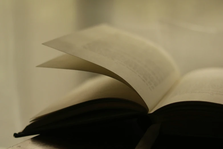 an open book laying on top of a desk