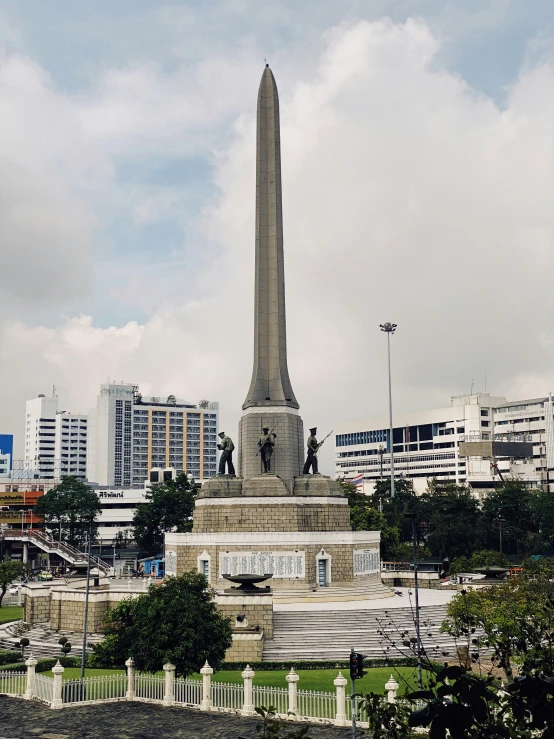 the tall monument is in a very large city park