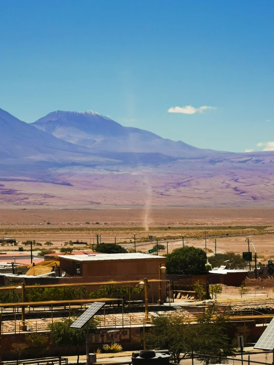 an image of a mountain behind the city