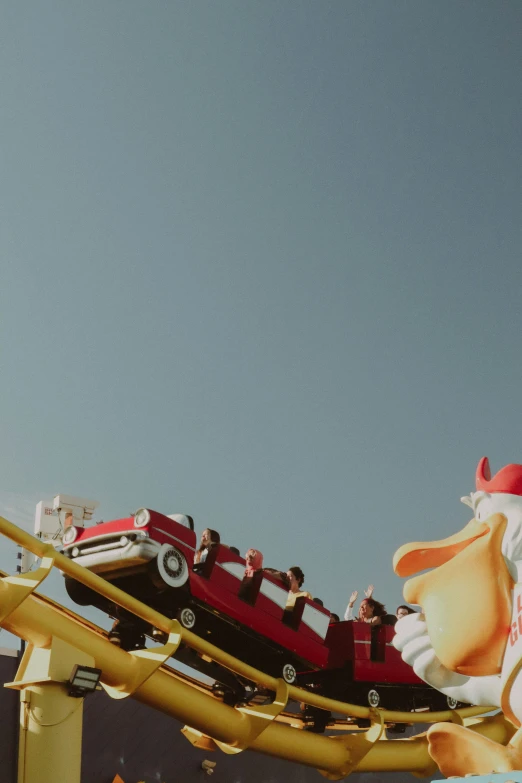 two roller coasters with a santa claus on top