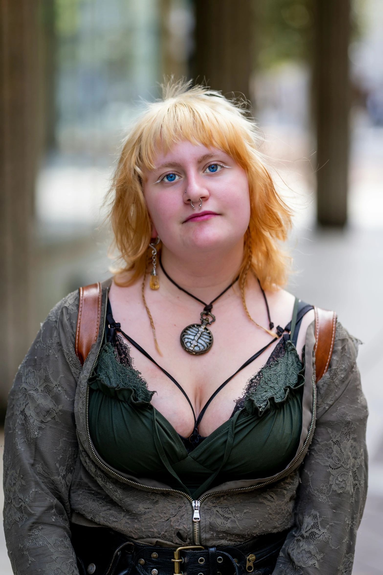 an orange haired woman in a corset is posing for the camera