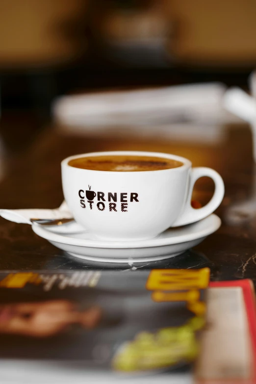 a close up of a coffee cup on a saucer