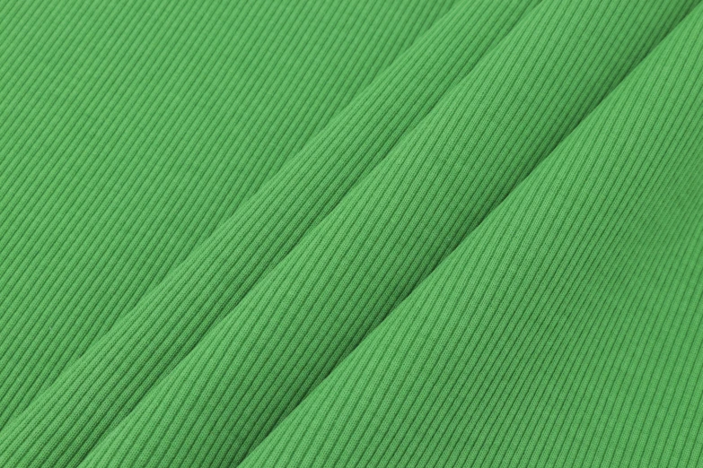 a green fabric texture with the visible colors