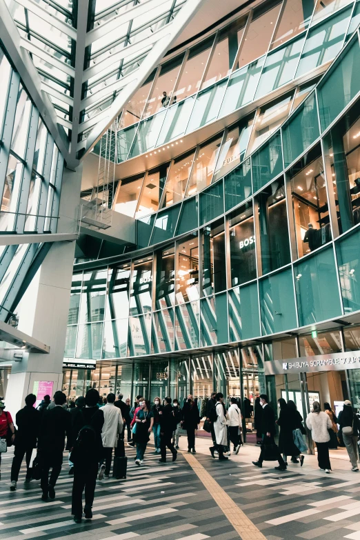 a group of people walking around a building