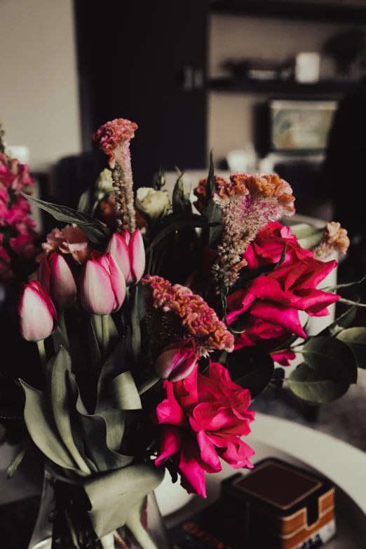 a vase filled with flowers on top of a table