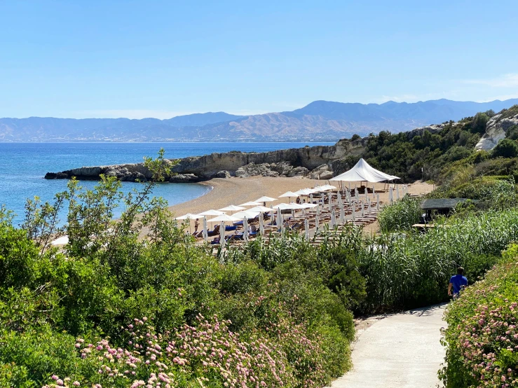 a path that is next to the beach