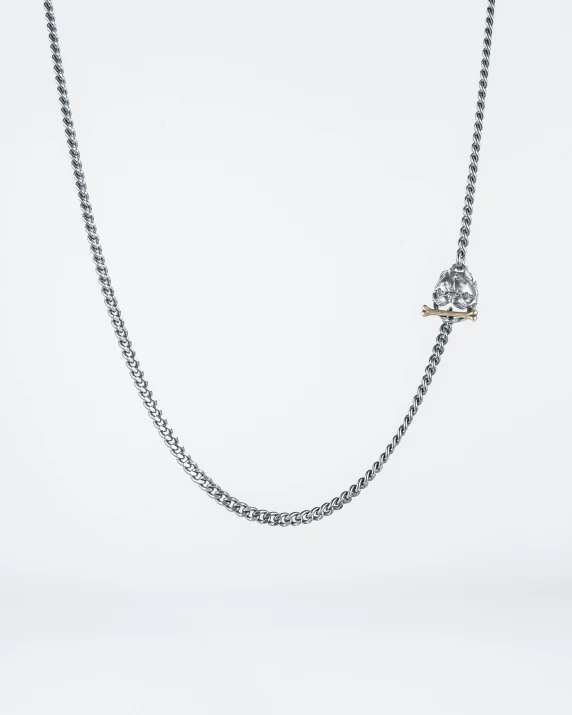 a necklace with diamond beads and a pearl ball