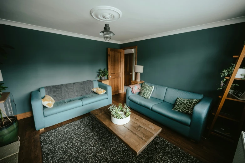 a living room that has a couch and two chairs