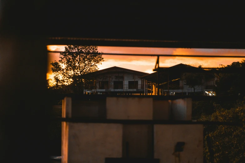 dusk over a city from a window of an apartment complex