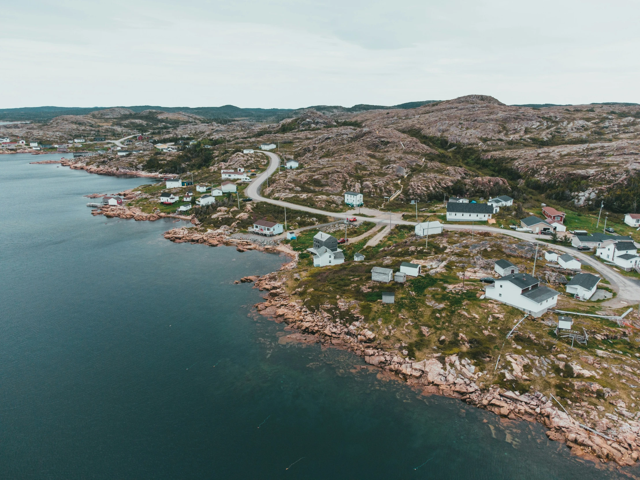 an aerial view of small town by the ocean