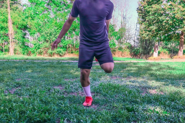 a man is running through a field with a frisbee