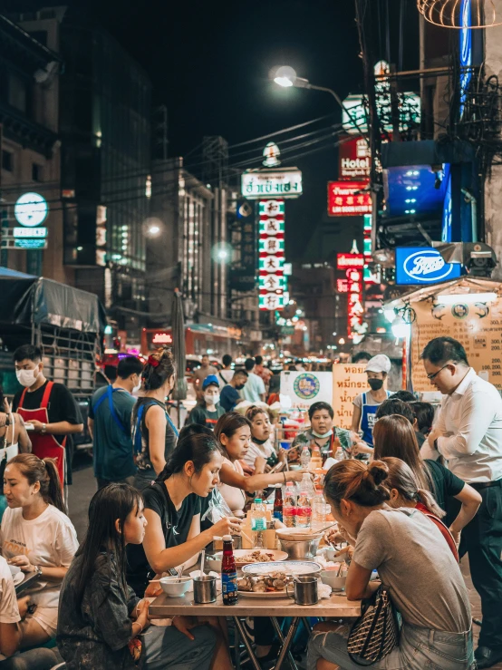 a large group of people sitting at tables