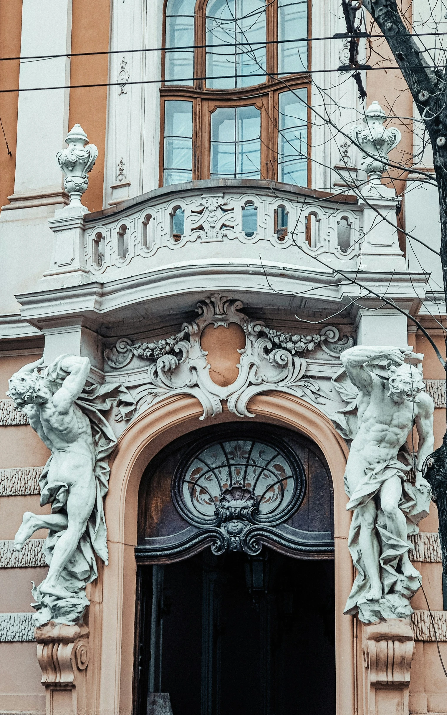 the doors and front steps to an old brick building