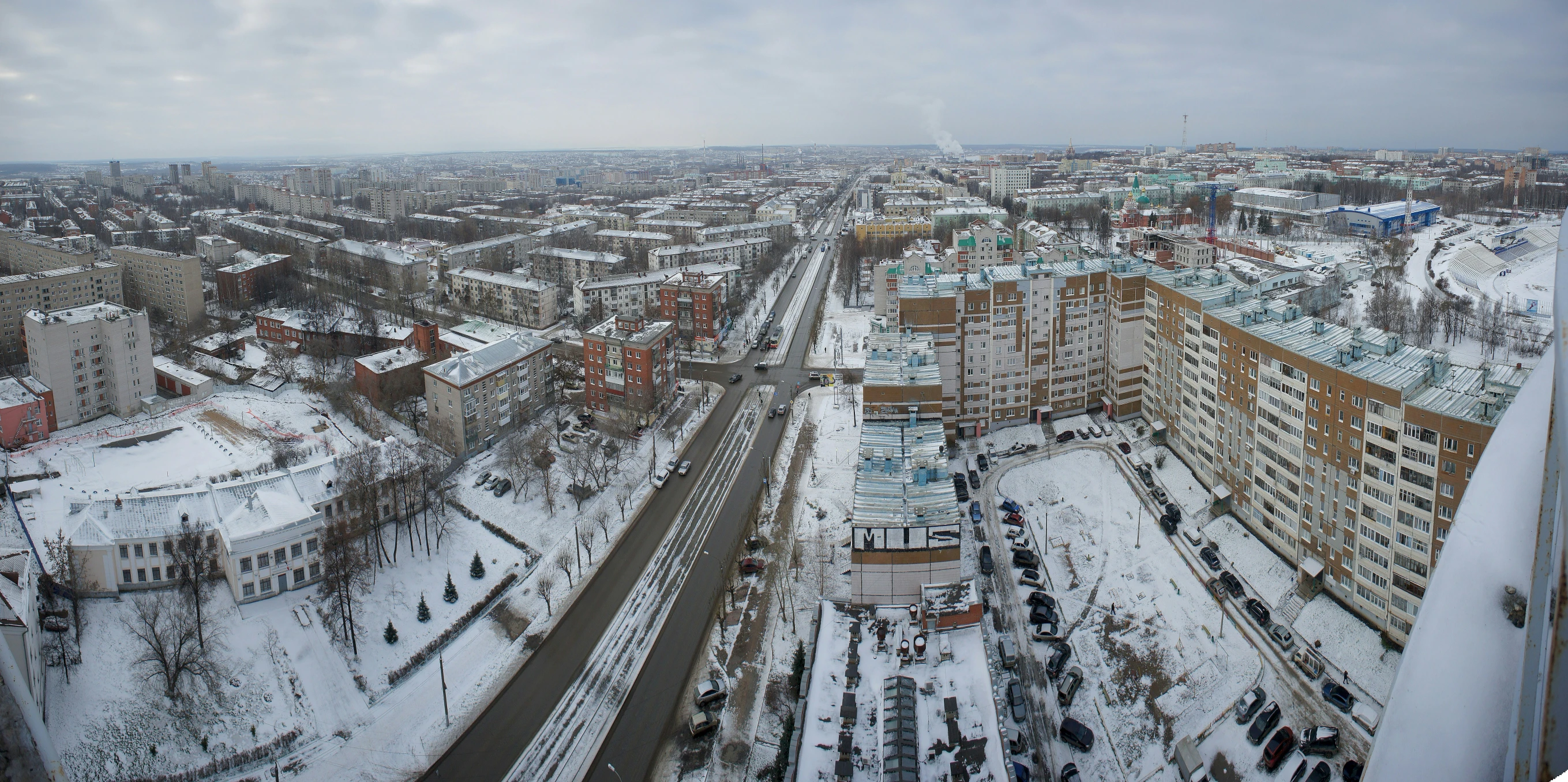an overhead view of a city surrounded by snow