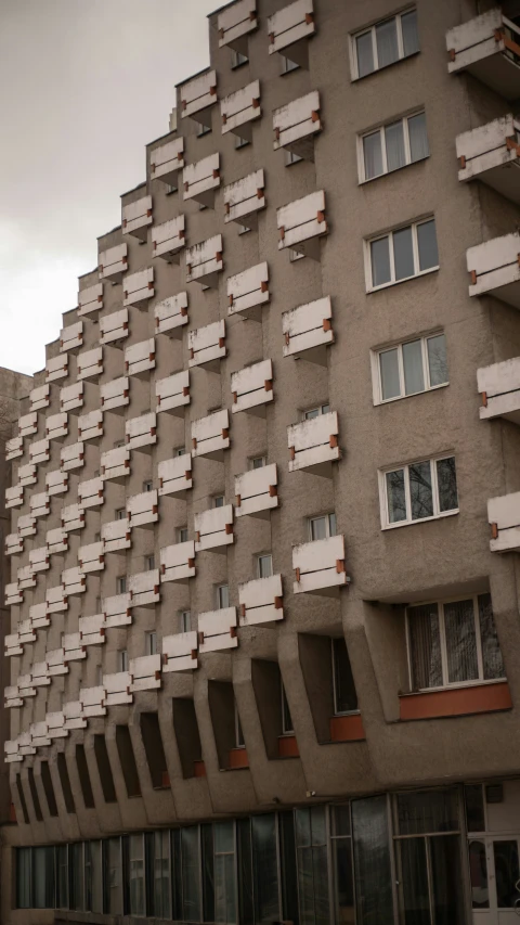 a large building has very large windows and many smaller ones