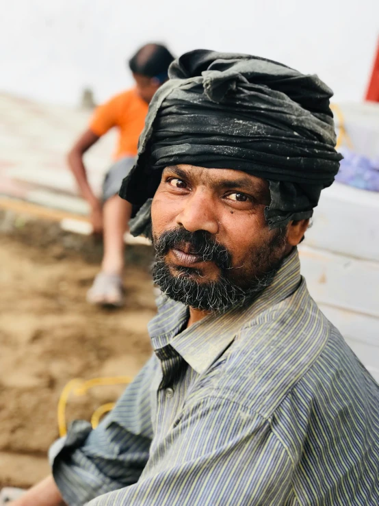 an image of man with a turban and beard