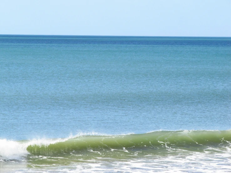 a person on a surfboard near the beach