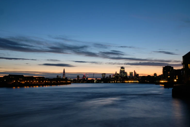 the skyline of london with a blue sky above