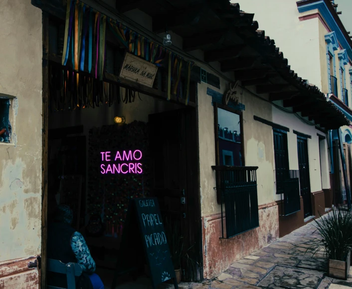 neon sign and shop name displayed outside restaurant