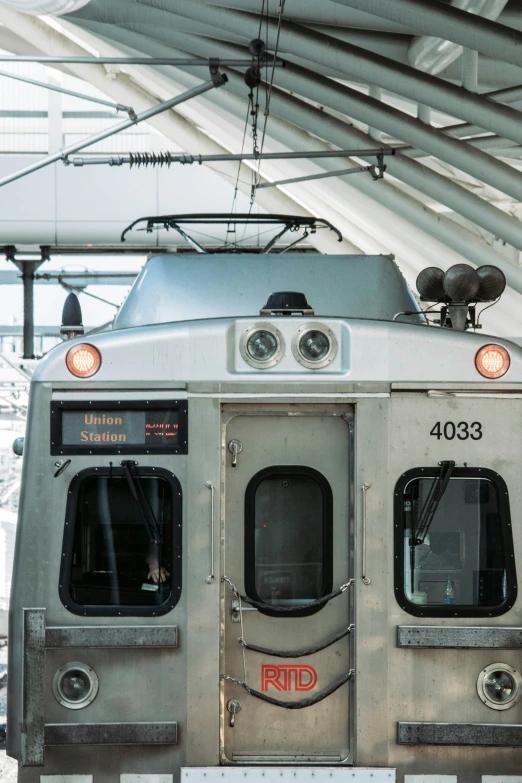 an old looking train sits on a track