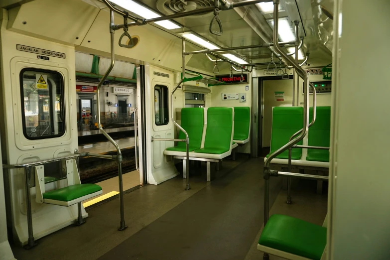 empty passenger train with lime green seats