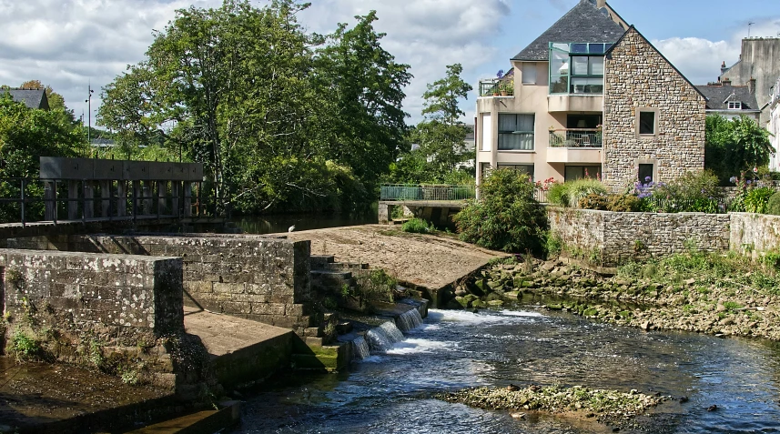 this is a water way next to some brick buildings