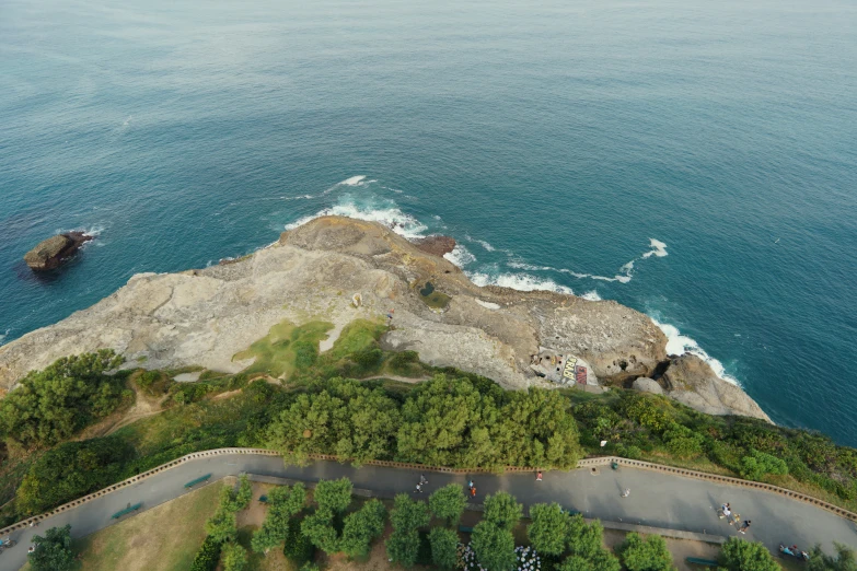 a rock outcropping next to the ocean