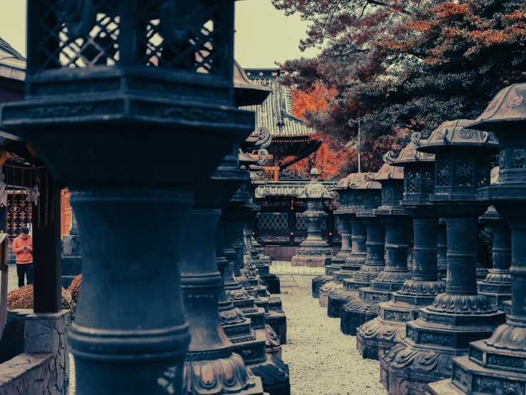 a stone area in a park with many different kinds of statues