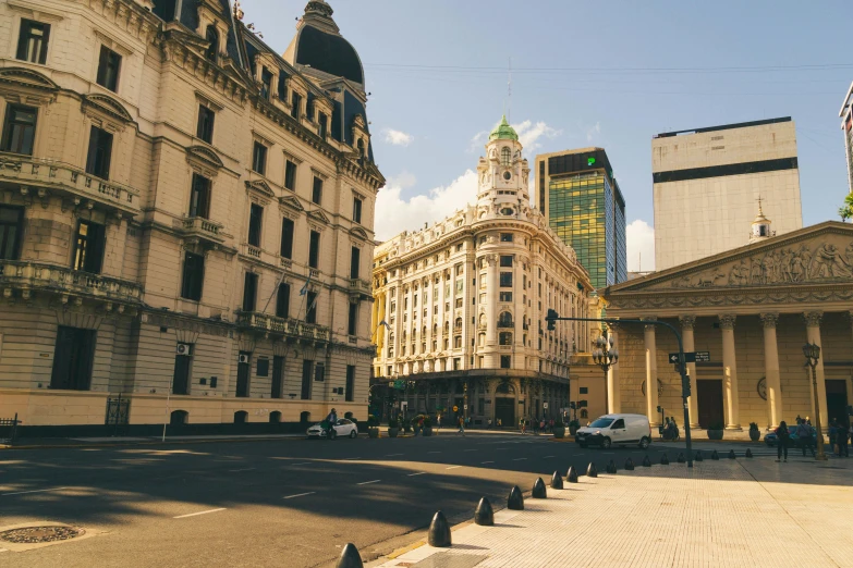 a city with tall buildings and columns is shown