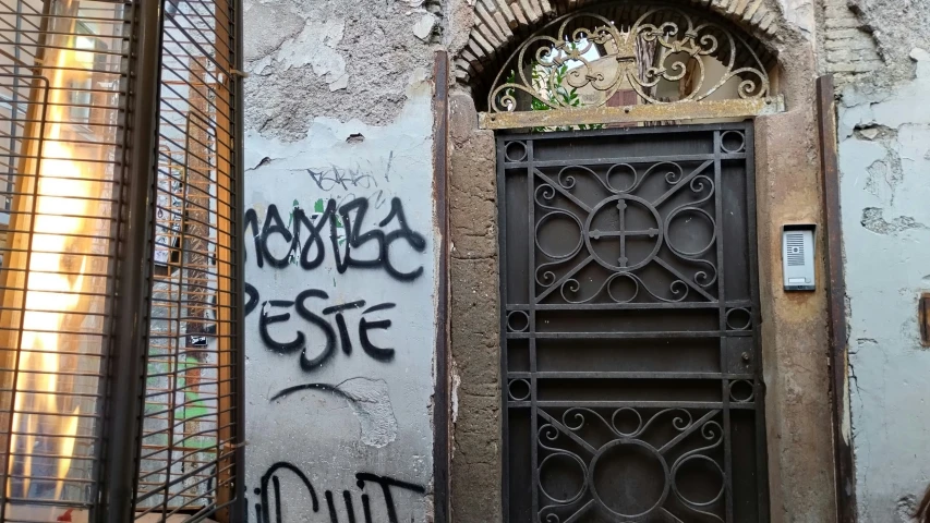 a door to a building with graffiti on it