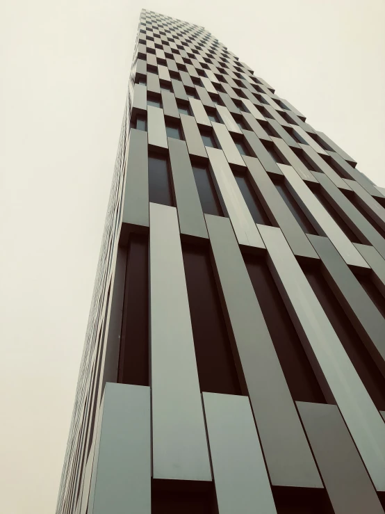 the view looking up from the bottom of a tall building