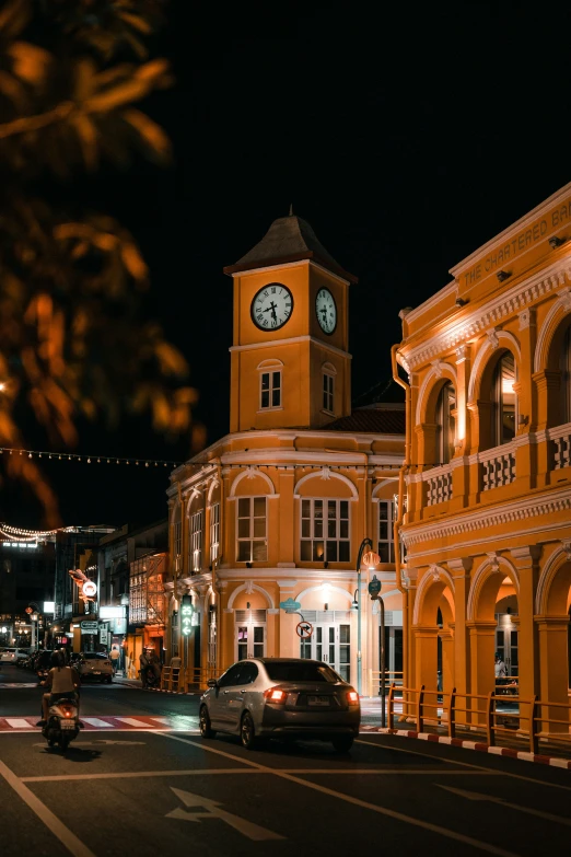 a building has a clock on it at night