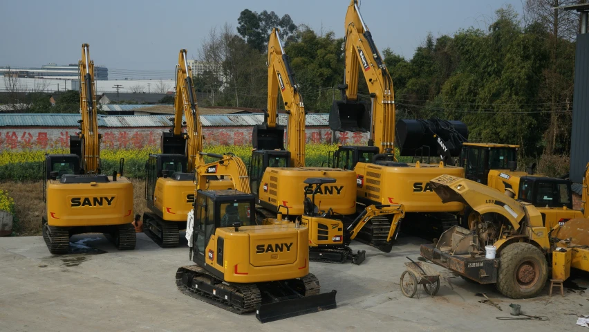 a large number of yellow vehicles parked in a lot