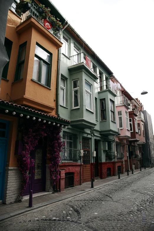 a row of colored houses on a street