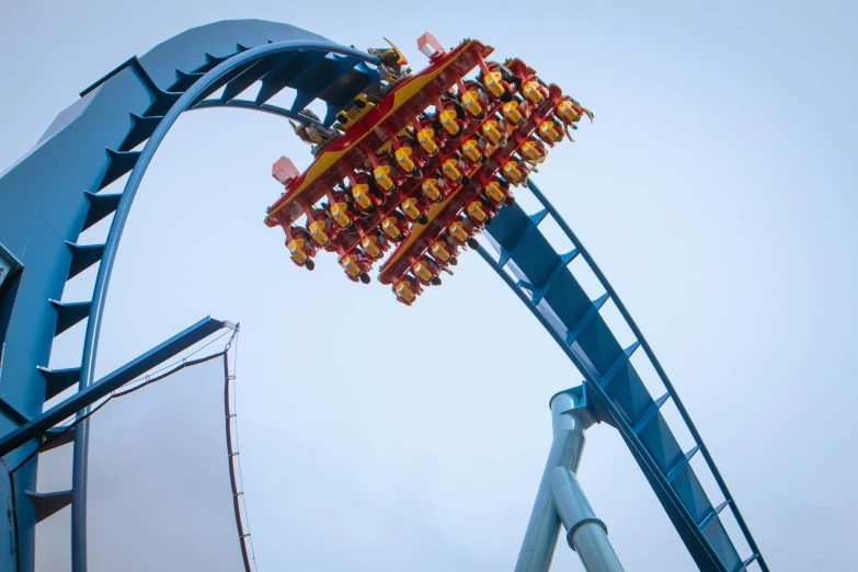 an overhanging ride for people with a roller coaster