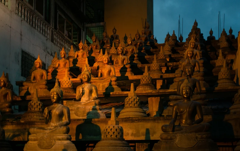 a room filled with lots of buddhist statues