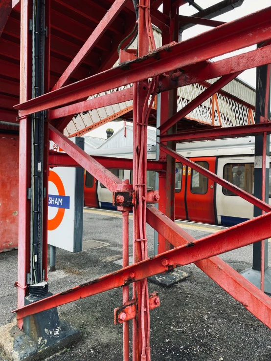 a red and white train in a station area