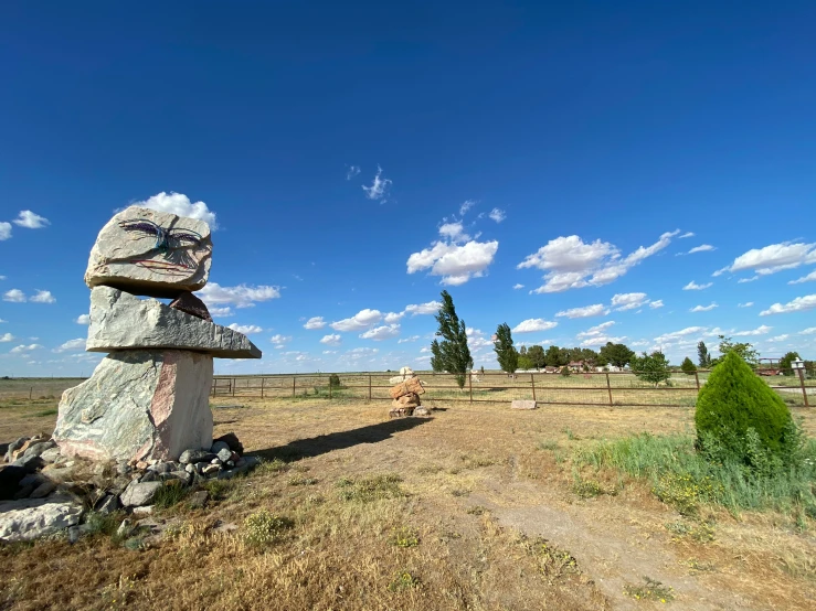 a big rock on the side of a road