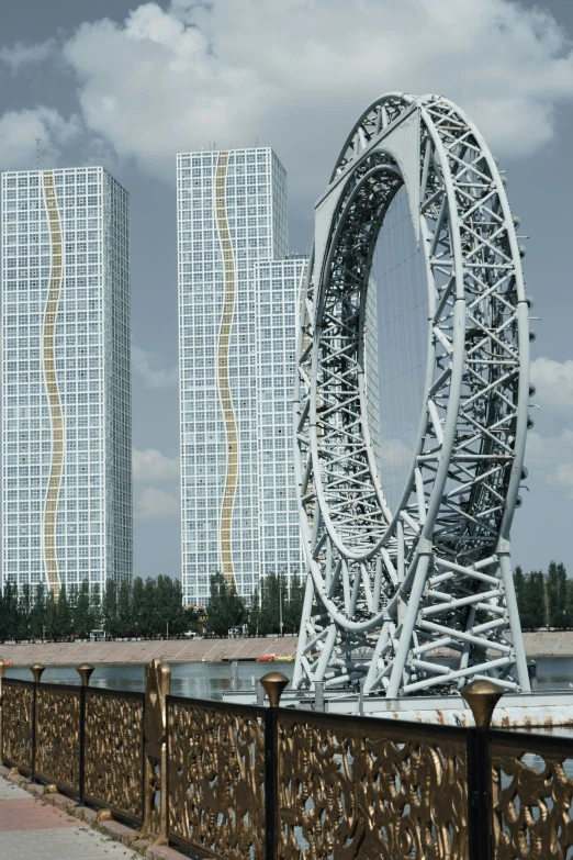 an amut wheel and two very tall buildings