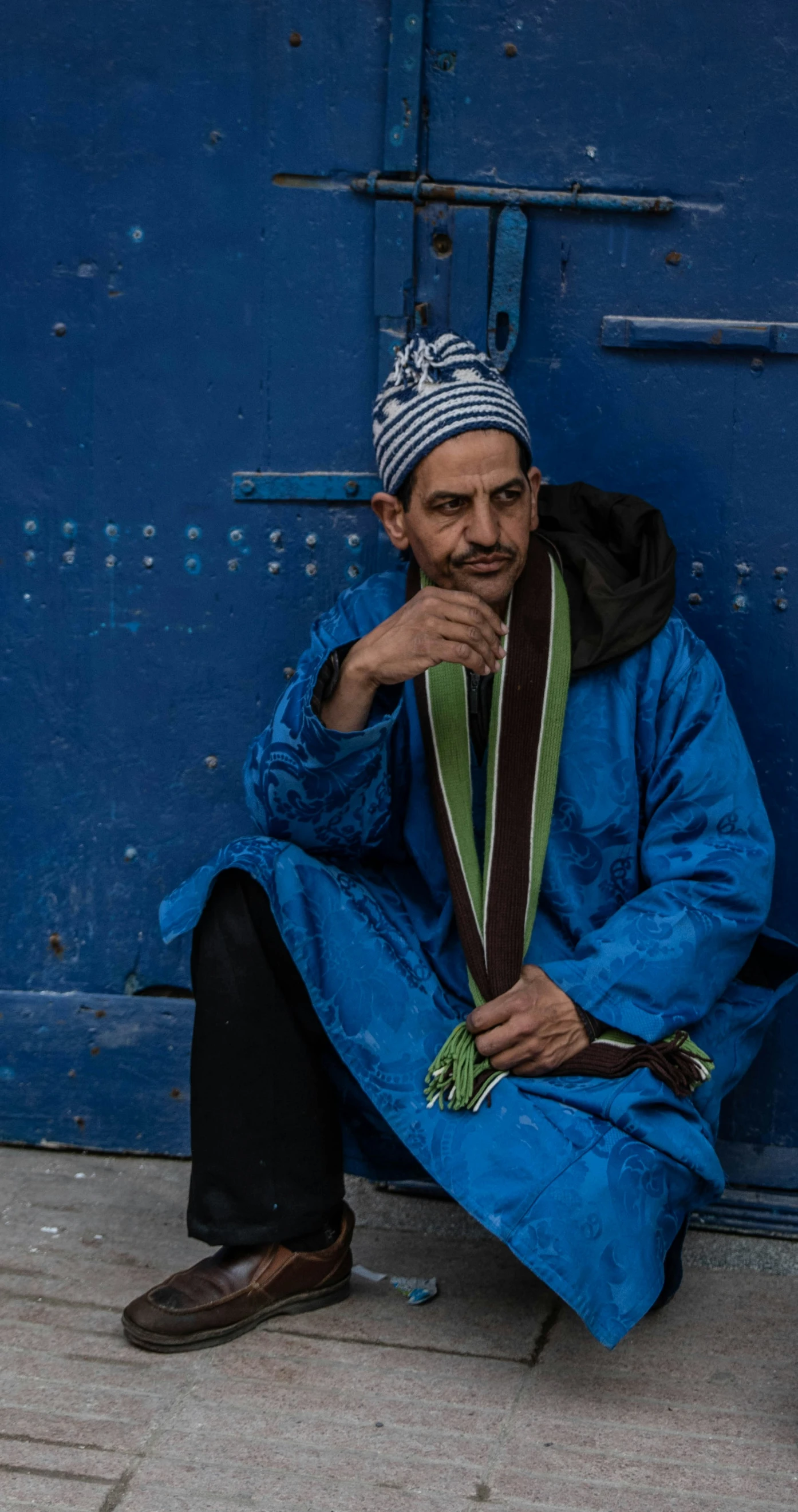 a man that is sitting on a step